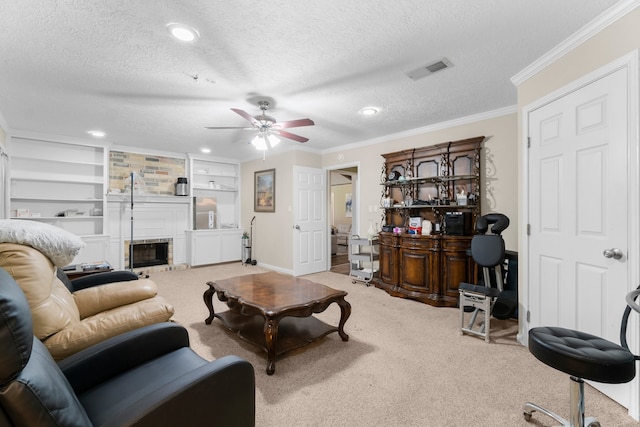 carpeted living room with ceiling fan, a textured ceiling, crown molding, and built in shelves