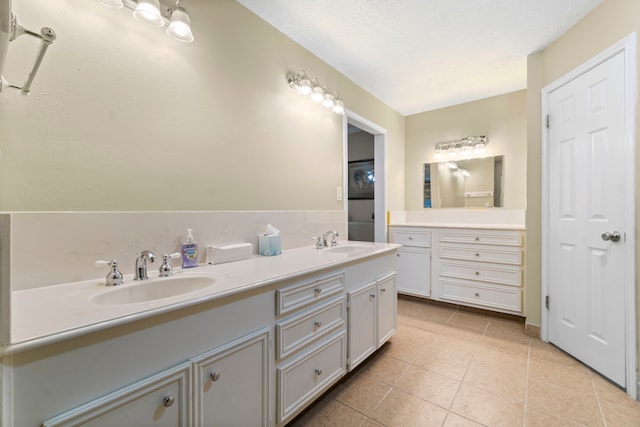 bathroom featuring tile patterned floors and vanity