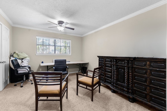 home office with ceiling fan, light colored carpet, a textured ceiling, and crown molding