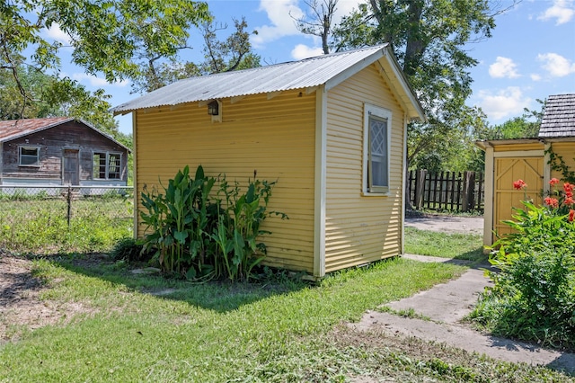 view of shed with fence