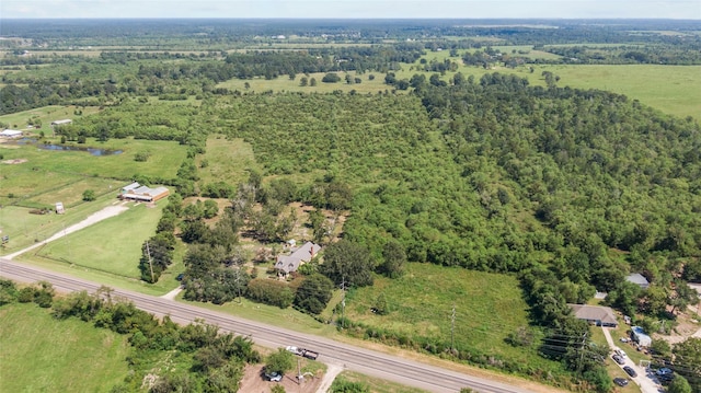 birds eye view of property with a rural view