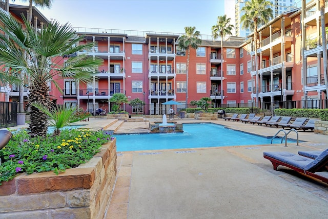 view of swimming pool with a patio area