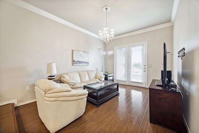 living room featuring ornamental molding, a chandelier, and dark hardwood / wood-style flooring