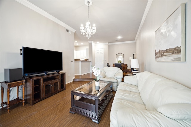 living room with ornamental molding, dark wood-type flooring, and a chandelier