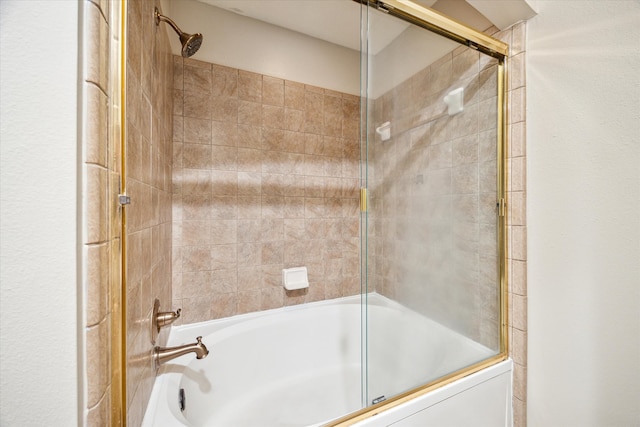 bathroom featuring bath / shower combo with glass door