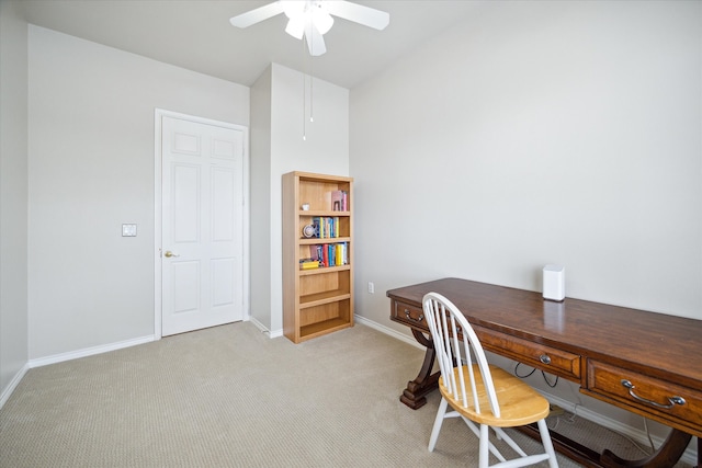 carpeted home office with ceiling fan