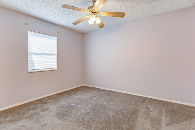 carpeted empty room featuring a textured ceiling and ceiling fan