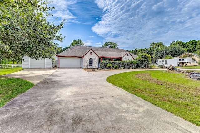 view of front of house featuring a front yard and a garage