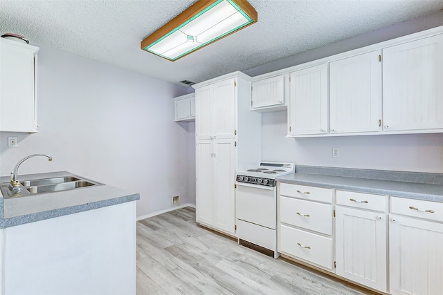 kitchen with white cabinets, sink, a textured ceiling, light hardwood / wood-style flooring, and white range oven