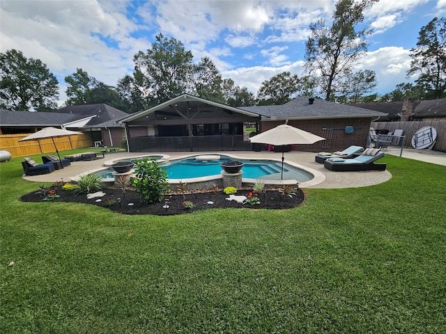 view of pool featuring a lawn and a patio