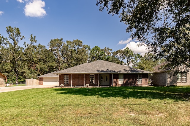 single story home featuring a front yard and a garage