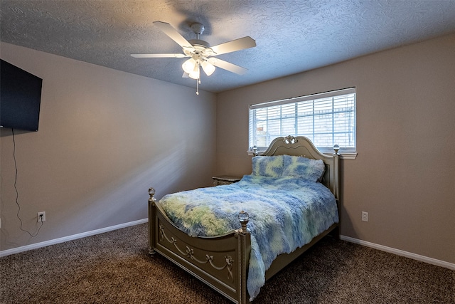 carpeted bedroom featuring ceiling fan and a textured ceiling