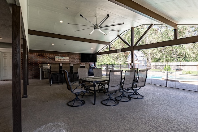 exterior space with ceiling fan, a fenced in pool, and an outdoor bar