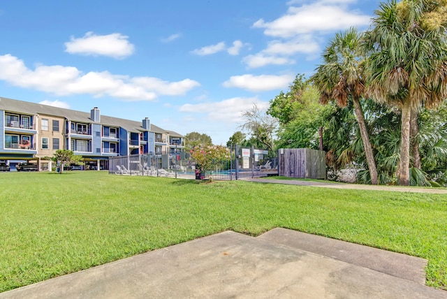 view of property's community with a lawn