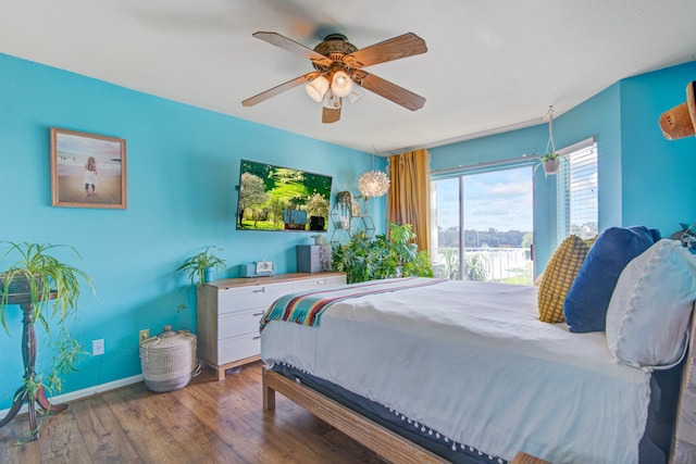 bedroom featuring access to outside, ceiling fan, and wood-type flooring