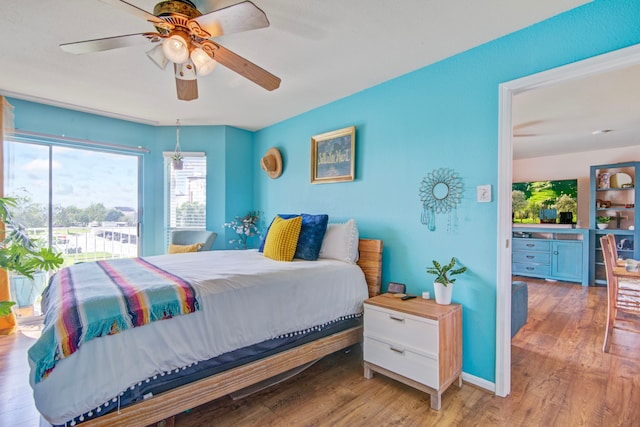 bedroom featuring light hardwood / wood-style flooring and ceiling fan