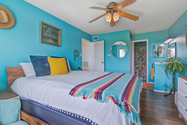 bedroom with ceiling fan and dark hardwood / wood-style floors