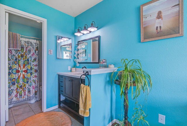 bathroom featuring tile patterned flooring and vanity