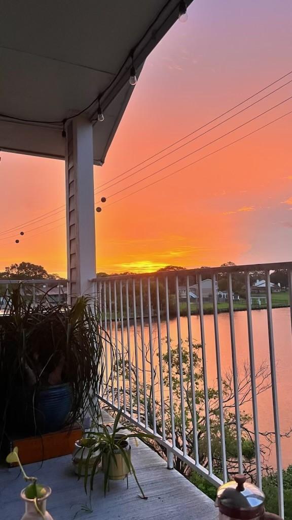 view of balcony at dusk