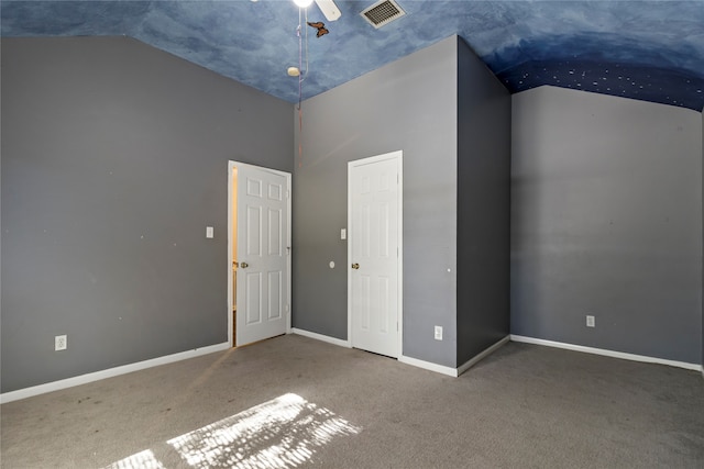 unfurnished bedroom featuring vaulted ceiling, ceiling fan, and carpet floors