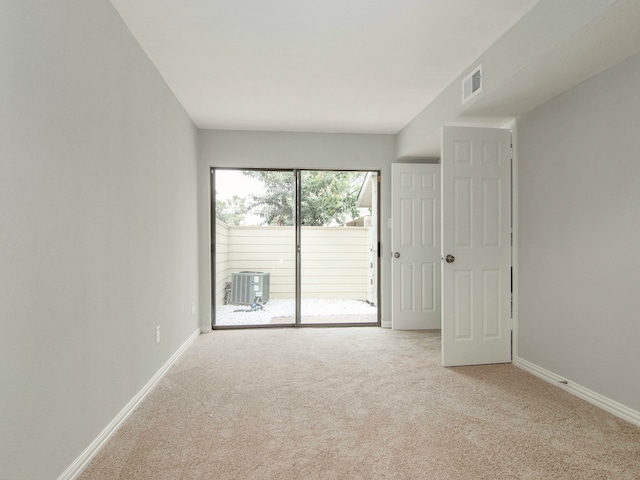 unfurnished room with light carpet