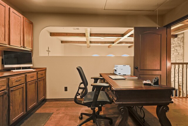 office space featuring coffered ceiling, dark hardwood / wood-style floors, and beam ceiling