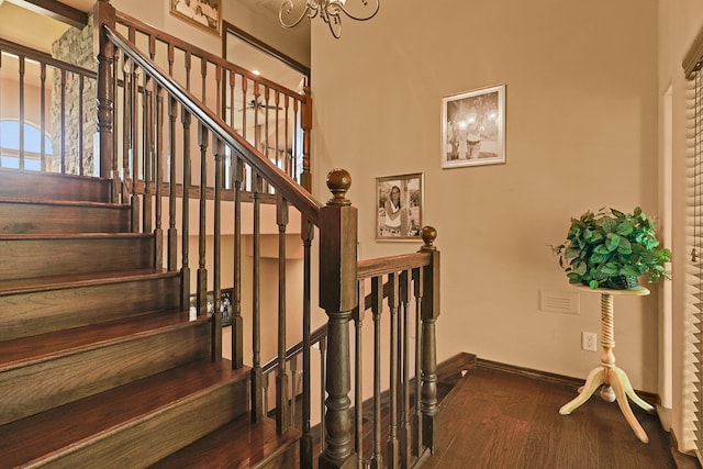 staircase featuring hardwood / wood-style flooring