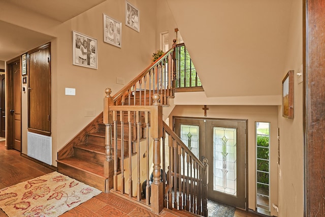 interior space with dark wood-type flooring and french doors