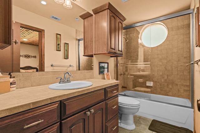 full bathroom with enclosed tub / shower combo, tile patterned floors, toilet, tasteful backsplash, and vanity