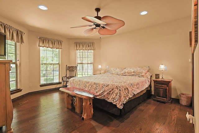 bedroom with ceiling fan and dark hardwood / wood-style floors