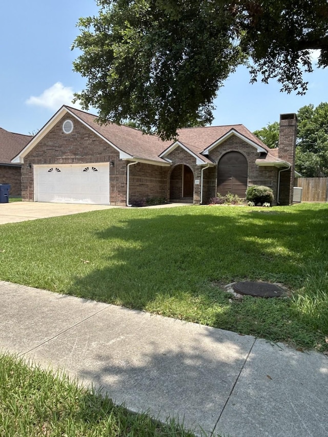 ranch-style house with a front lawn and a garage