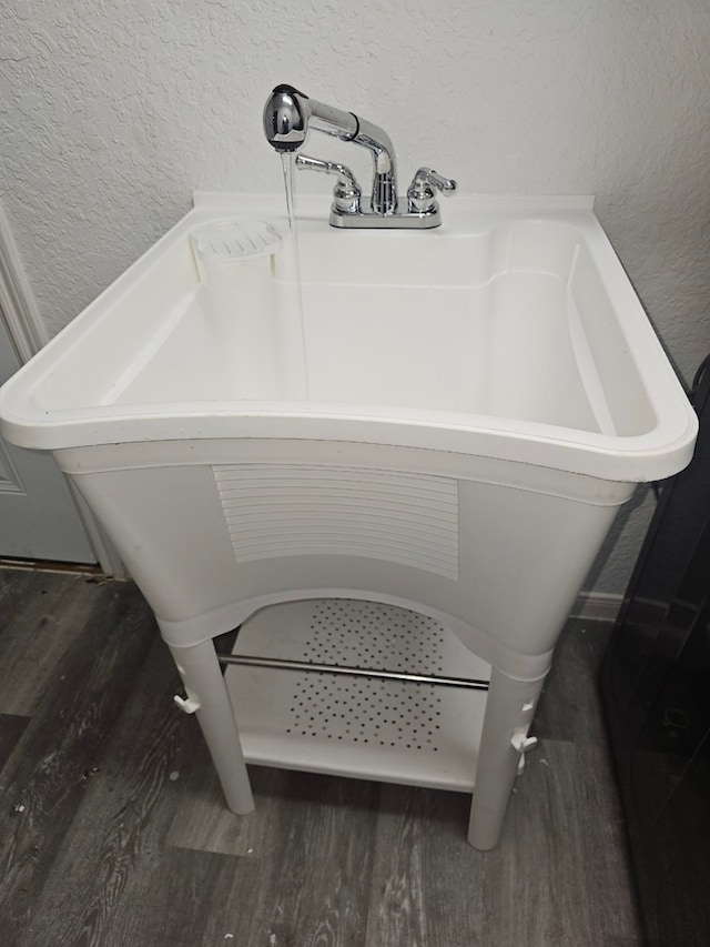 bathroom with sink and hardwood / wood-style floors