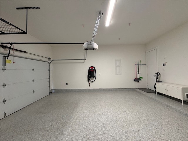 garage featuring a garage door opener