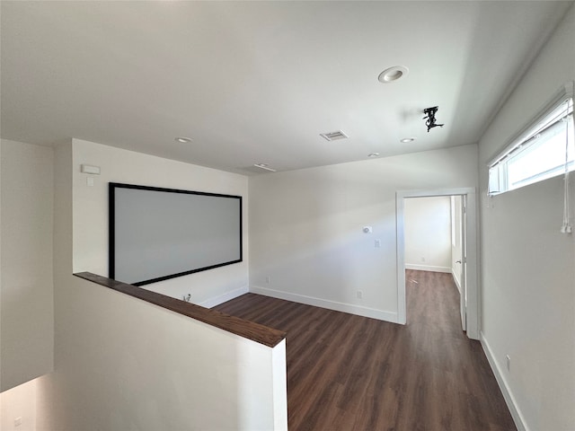 interior space with dark hardwood / wood-style floors