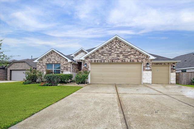 ranch-style house featuring a front lawn and a garage