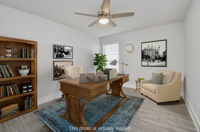 home office featuring ceiling fan and light hardwood / wood-style floors