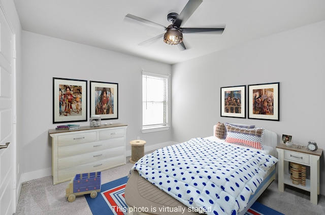 bedroom with ceiling fan and light carpet