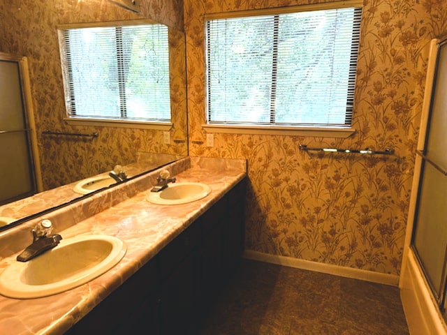 bathroom with enclosed tub / shower combo and vanity