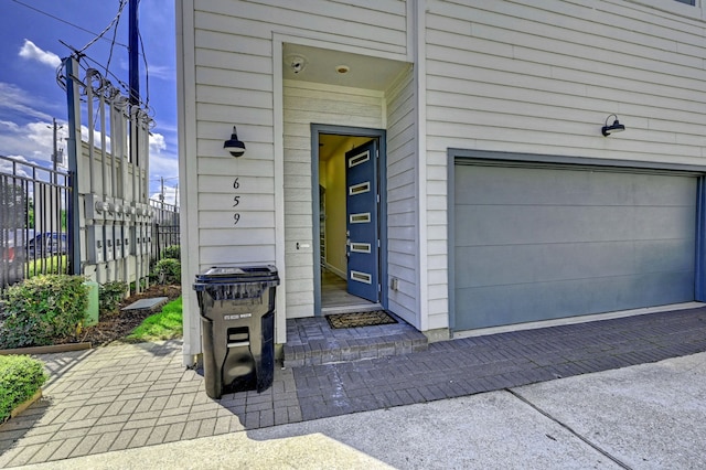 doorway to property featuring a garage