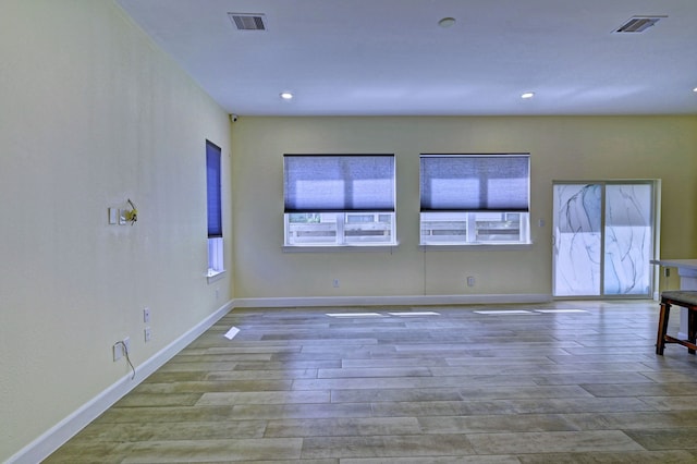 spare room with light wood-type flooring