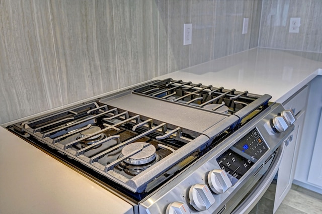 interior details featuring stainless steel range with gas cooktop