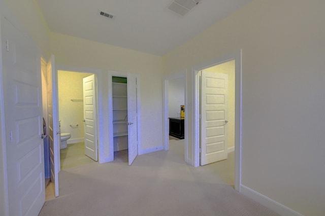 corridor with light colored carpet