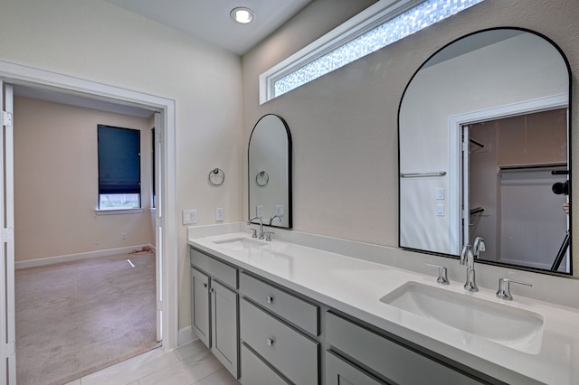 bathroom with tile patterned floors and vanity