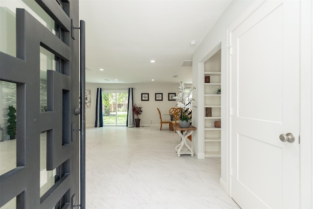 hall with visible vents, recessed lighting, marble finish floor, and baseboards