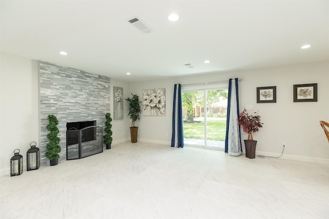 living area featuring recessed lighting, visible vents, and a fireplace