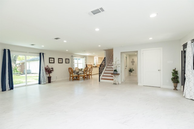 interior space with a wealth of natural light, visible vents, recessed lighting, and stairway