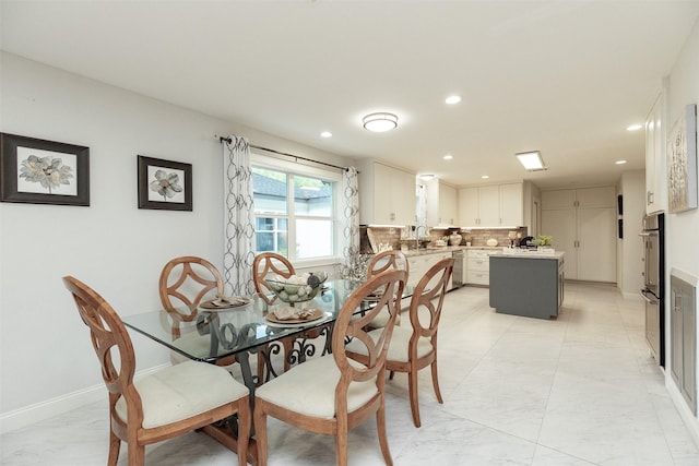 dining area with recessed lighting, marble finish floor, and baseboards