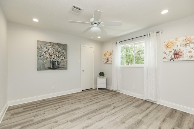 unfurnished room featuring a ceiling fan, visible vents, baseboards, recessed lighting, and light wood-style floors