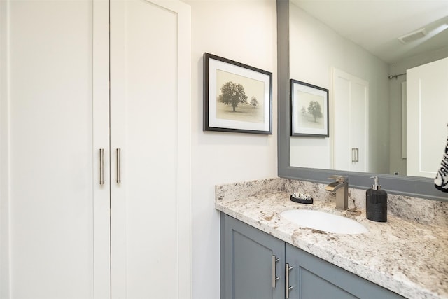 bathroom featuring vanity and visible vents