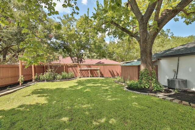 view of yard with central AC